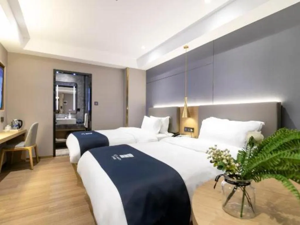 Bed in Echarm Hotel Guangzhou Gangding Huashi Metro Station