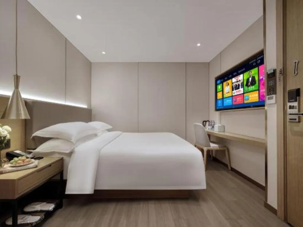 Bed in Echarm Hotel Guangzhou Gangding Huashi Metro Station