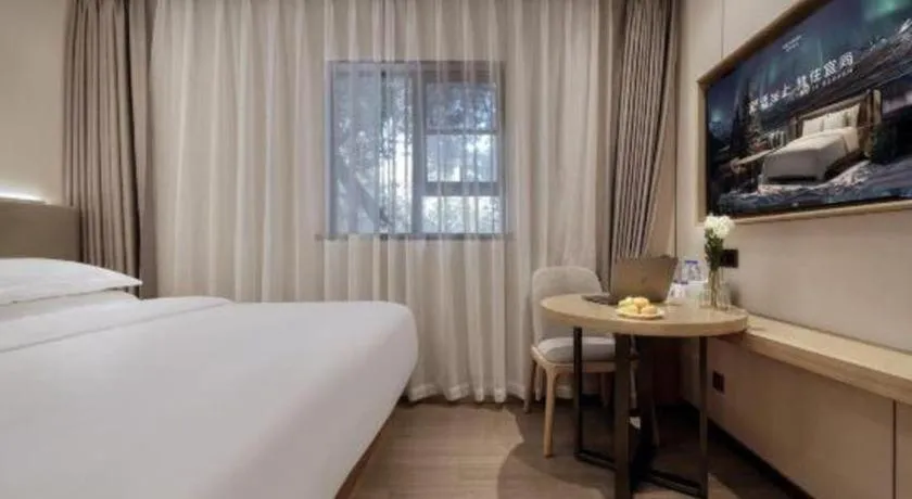 Bed in Echarm Hotel Guangzhou Gangding Huashi Metro Station