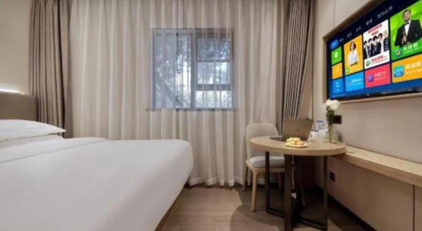 Bed in Echarm Hotel Guangzhou Gangding Huashi Metro Station