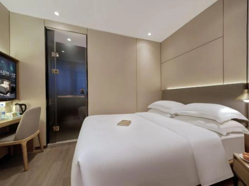 Bed in Echarm Hotel Guangzhou Gangding Huashi Metro Station