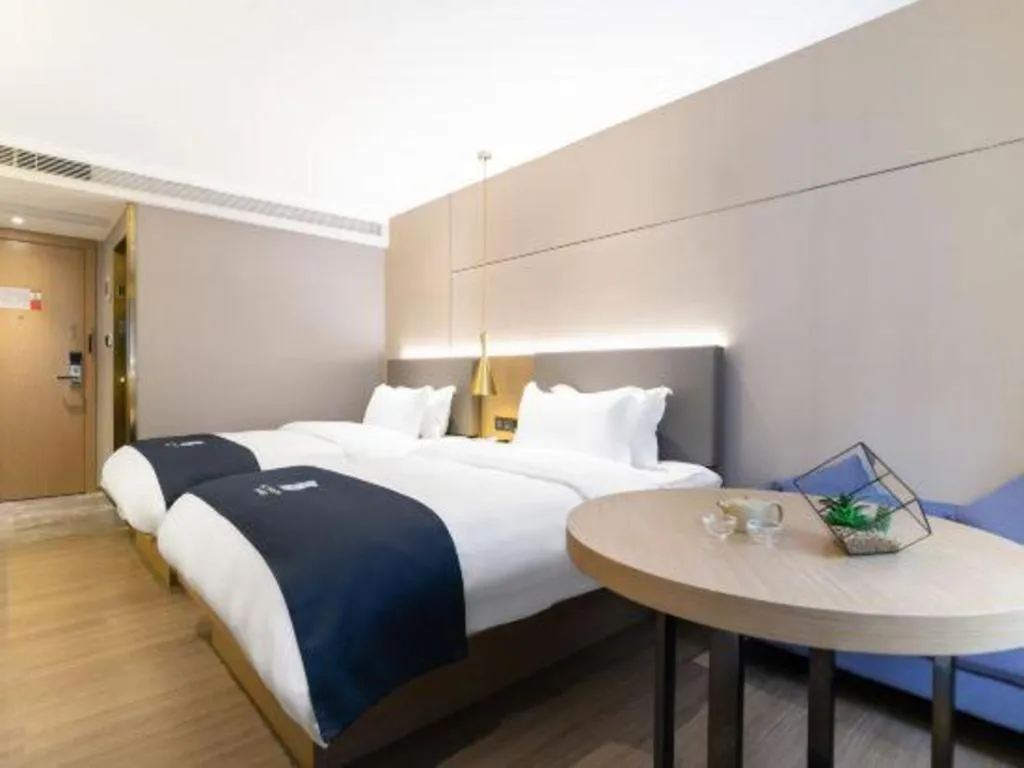 Bed in Echarm Hotel Guangzhou Gangding Huashi Metro Station