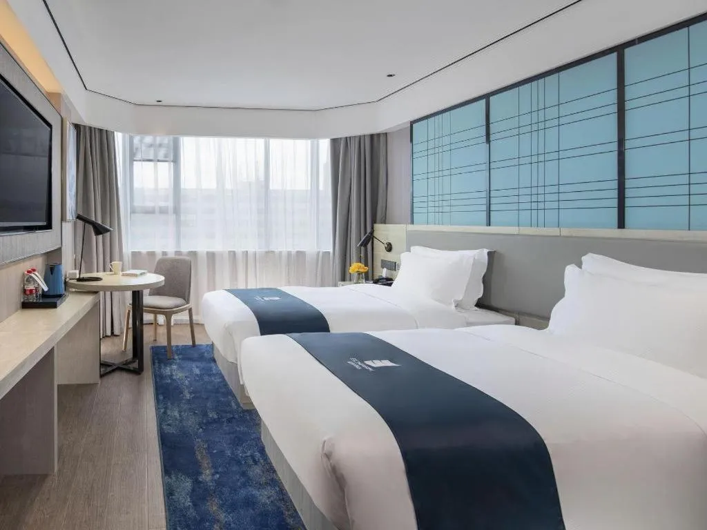 Bed in Echarm Hotel Shenzhen International Exhibition Center Fuyong