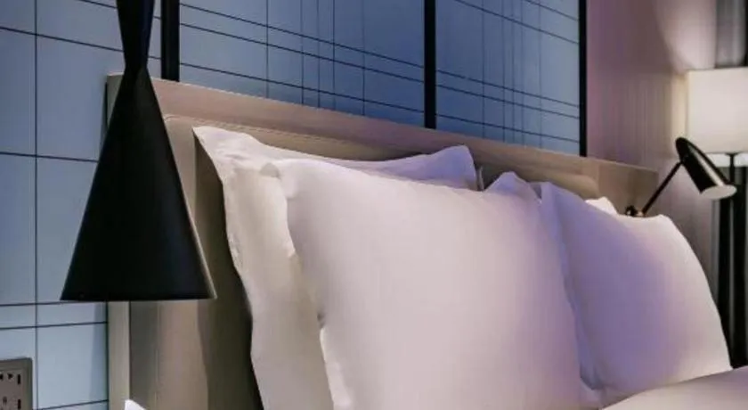 Bed in Echarm Hotel Shenzhen International Exhibition Center Fuyong