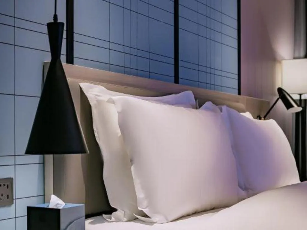 Bed in Echarm Hotel Shenzhen International Exhibition Center Fuyong