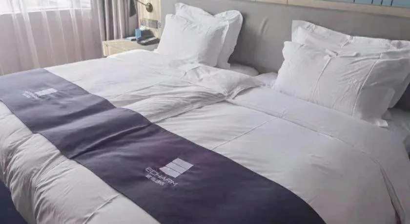 Bed in Echarm Hotel Shenzhen International Exhibition Center Fuyong