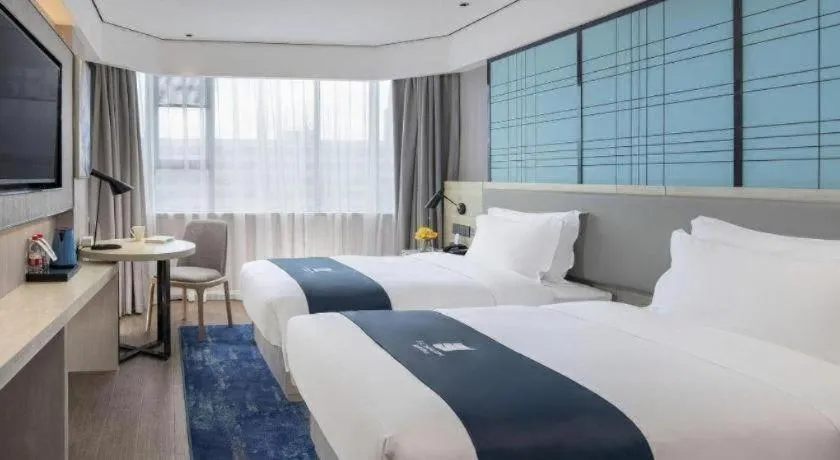 Bed in Echarm Hotel Shenzhen International Exhibition Center Fuyong