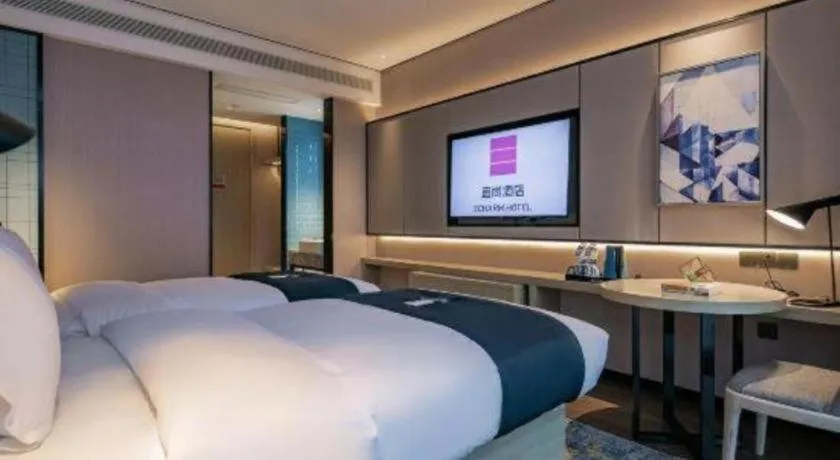 Bed in Echarm Hotel Shenzhen International Exhibition Center Fuyong