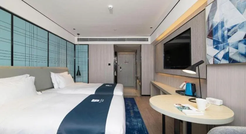 Bed in Echarm Hotel Shenzhen International Exhibition Center Fuyong