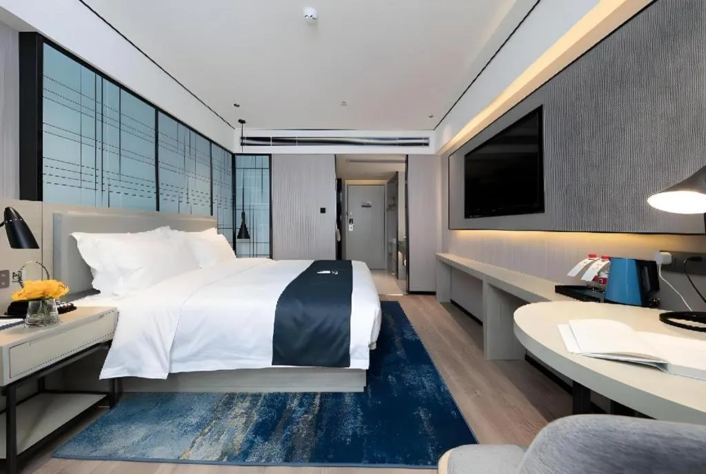 Bed in Echarm Hotel Shenzhen International Exhibition Center Fuyong