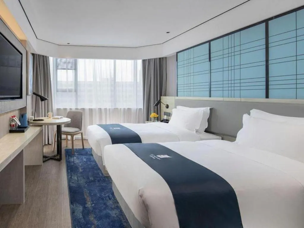 Bed in Echarm Hotel Shenzhen International Exhibition Center Fuyong