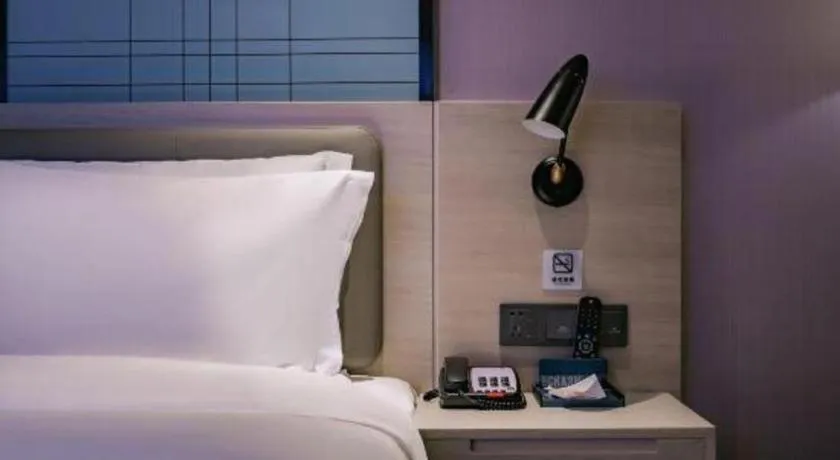 Bed in Echarm Hotel Shenzhen International Exhibition Center Fuyong