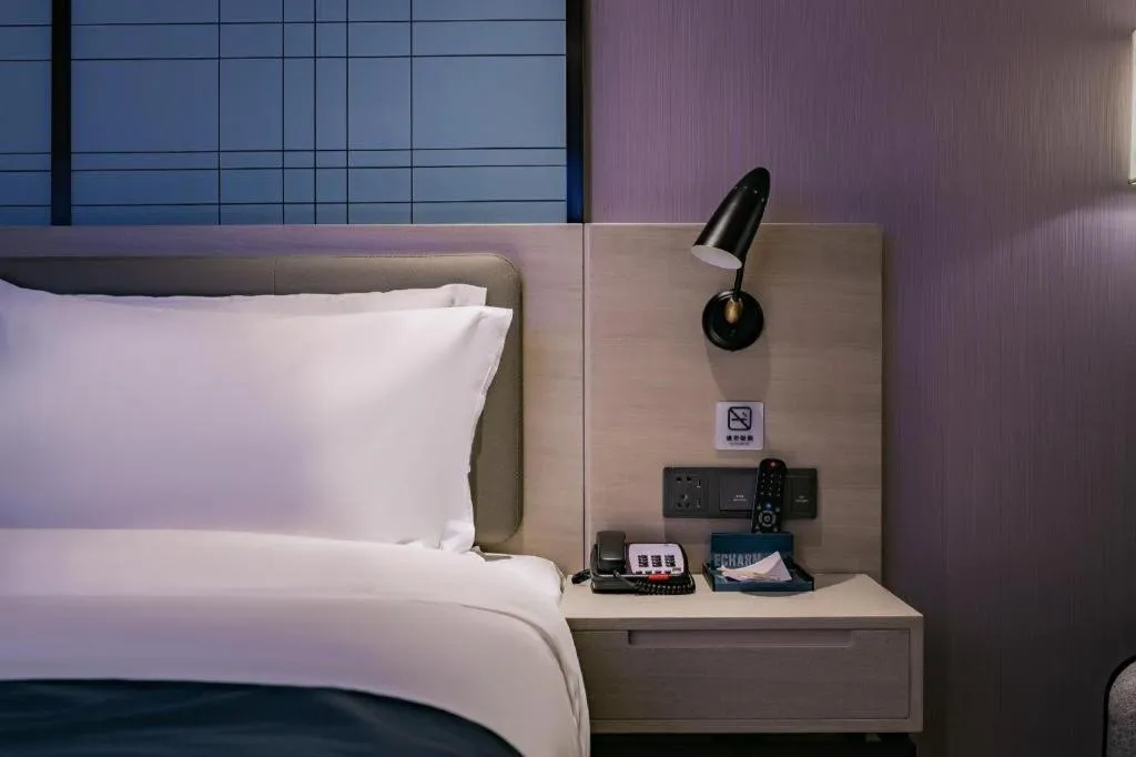 Bed in Echarm Hotel Shenzhen International Exhibition Center Fuyong