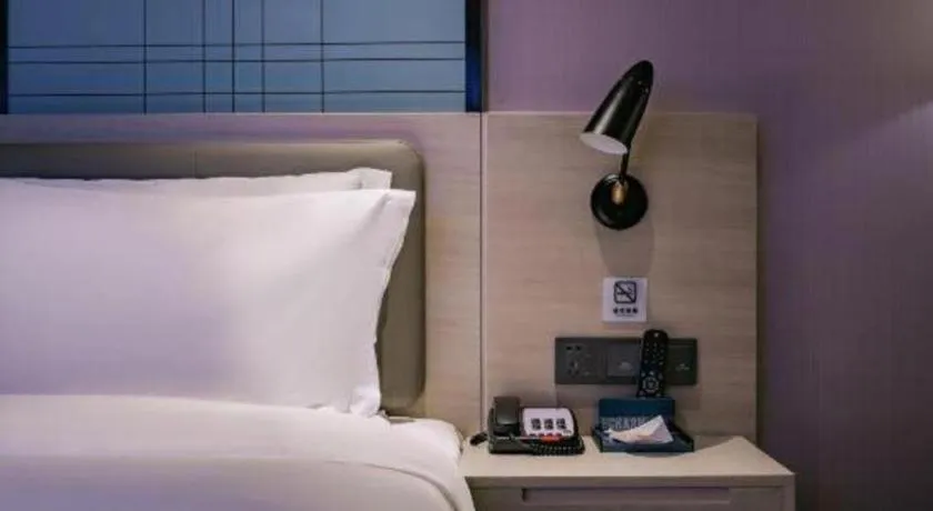 Bed in Echarm Hotel Shenzhen International Exhibition Center Fuyong