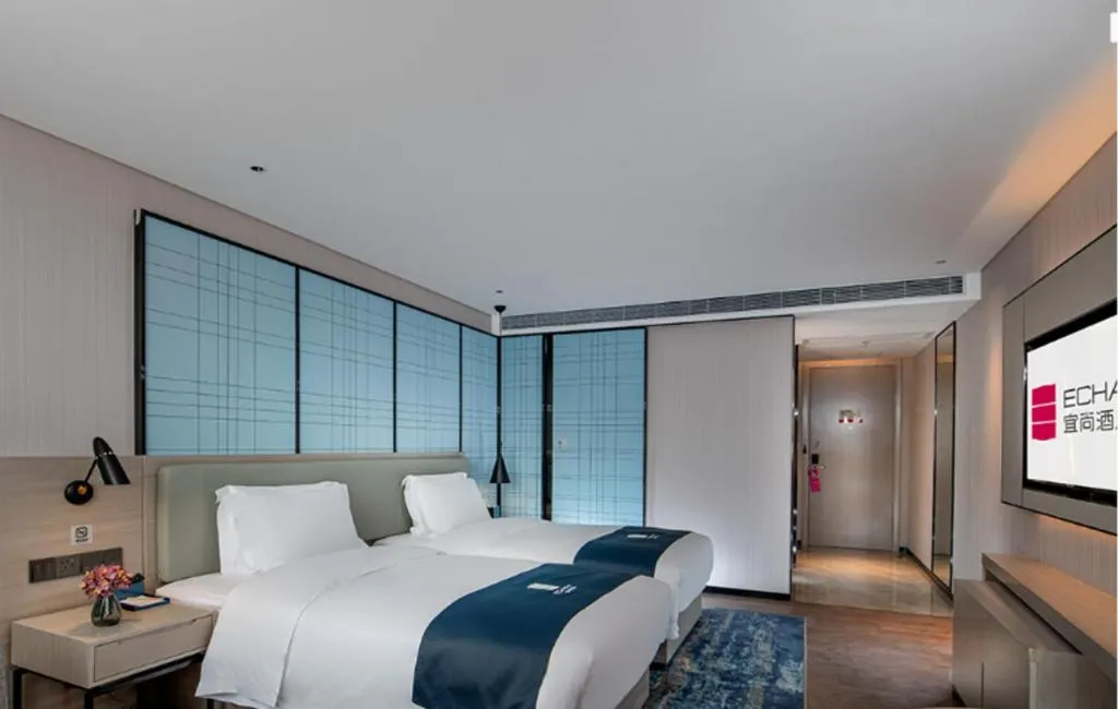 Bed in Echarm Hotel Shenzhen International Exhibition Center Fuyong