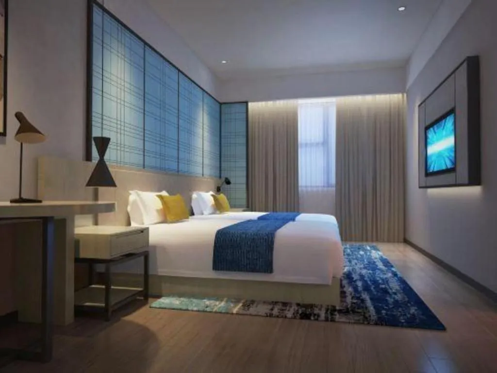 Bed in Echarm Hotel Shenzhen International Exhibition Center Fuyong