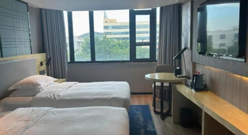 Bed in Echarm Hotel Shenzhen International Exhibition Center Fuyong