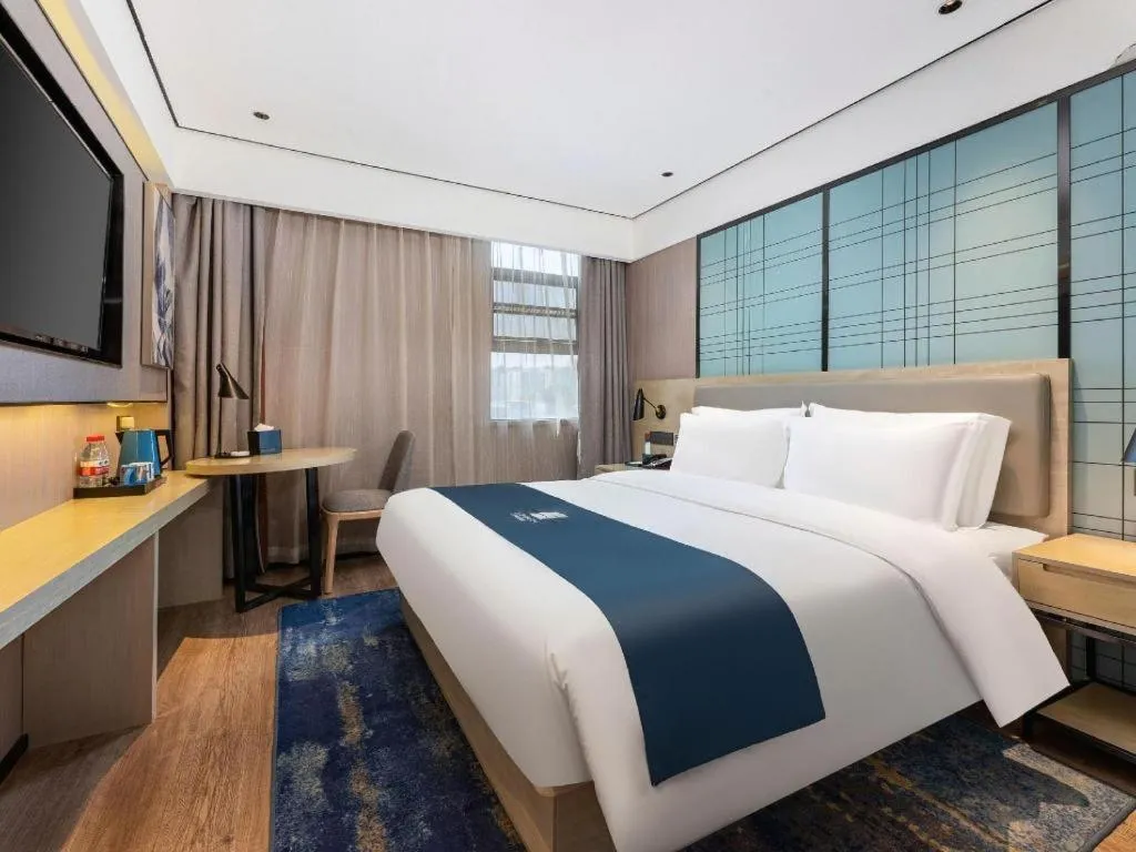 Bed in Echarm Hotel Shenzhen International Exhibition Center Fuyong