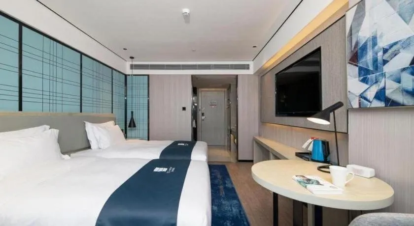 Bed in Echarm Hotel Shenzhen International Exhibition Center Fuyong