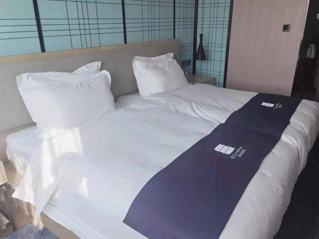 Bed in Echarm Hotel Shenzhen International Exhibition Center Fuyong