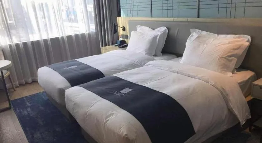 Bed in Echarm Hotel Shenzhen International Exhibition Center Fuyong