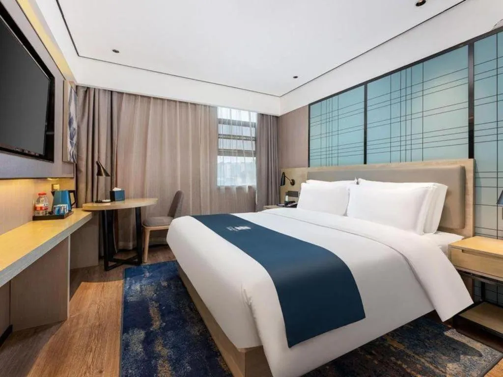 Bed in Echarm Hotel Shenzhen International Exhibition Center Fuyong