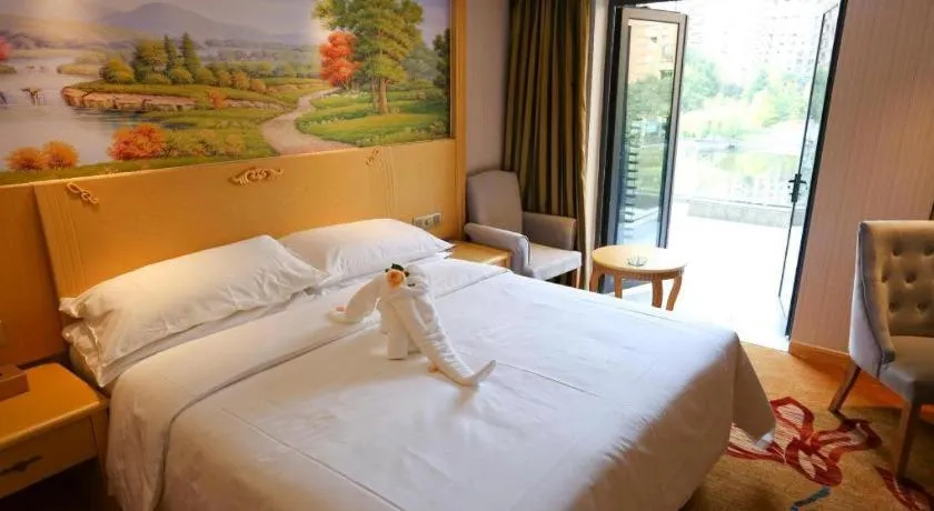 Bed in Vienna Hotel Hangzhou Jiubao Sijiqing Suanli Town