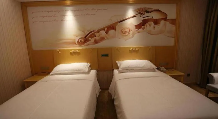 Bed in Vienna Hotel Hangzhou Jiubao Sijiqing Suanli Town
