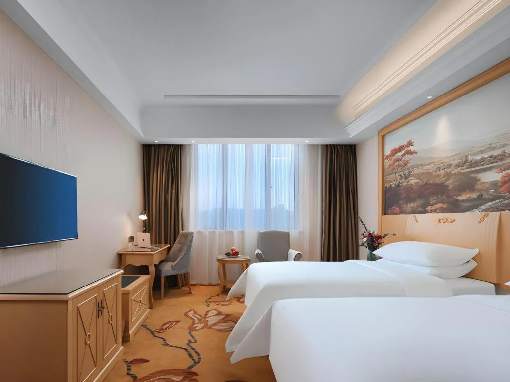 Bed in Vienna Hotel Hangzhou Jiubao Sijiqing Suanli Town