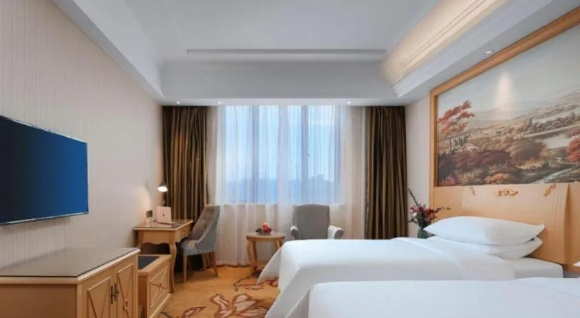 Bed in Vienna Hotel Hangzhou Jiubao Sijiqing Suanli Town