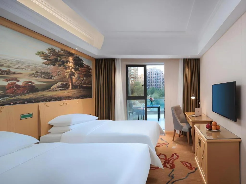 Bed in Vienna Hotel Hangzhou Jiubao Sijiqing Suanli Town