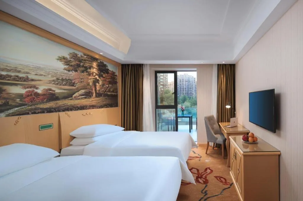 Bed in Vienna Hotel Hangzhou Jiubao Sijiqing Suanli Town