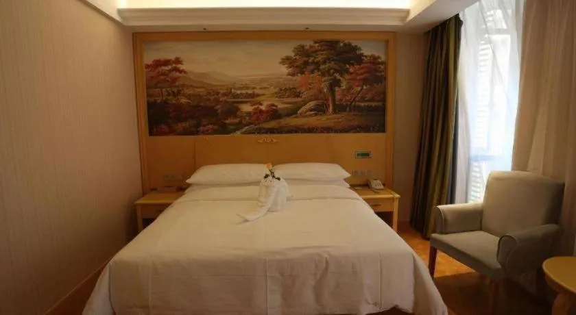 Bed in Vienna Hotel Hangzhou Jiubao Sijiqing Suanli Town
