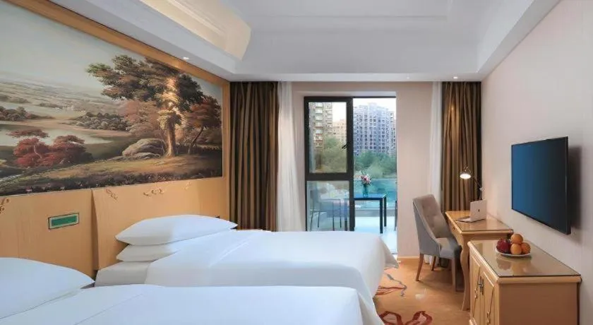 Bed in Vienna Hotel Hangzhou Jiubao Sijiqing Suanli Town