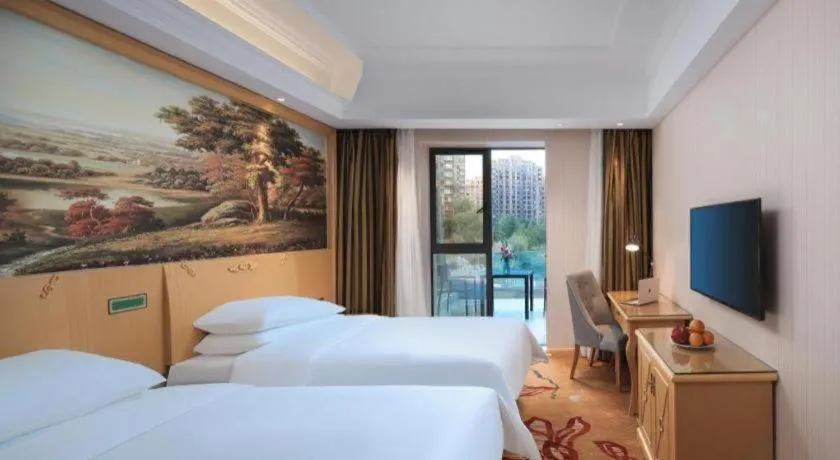 Bed in Vienna Hotel Hangzhou Jiubao Sijiqing Suanli Town