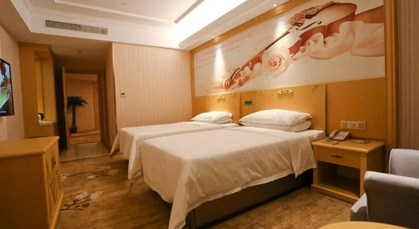 Bed in Vienna Hotel Hangzhou Jiubao Sijiqing Suanli Town