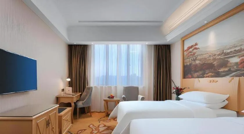 Bed in Vienna Hotel Hangzhou Jiubao Sijiqing Suanli Town