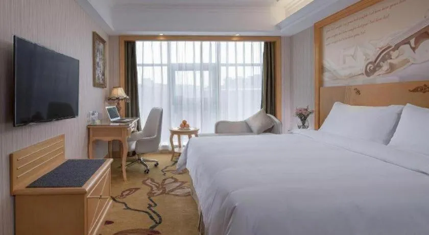Bed in Vienna Hotel Shenzhen Qinghu Metro Station
