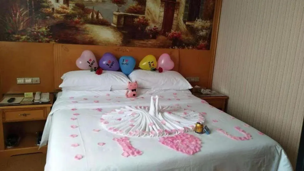 Bed in Vienna Hotel Shenzhen Guanlan Shanshuitianyuan Xintian