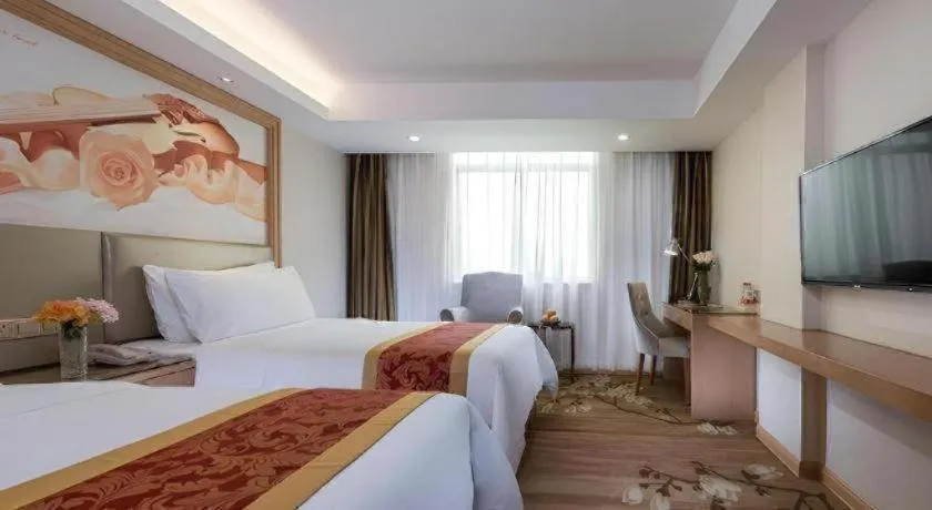 Bed in Vienna Hotel Shenzhen Guanlan Shanshuitianyuan Xintian