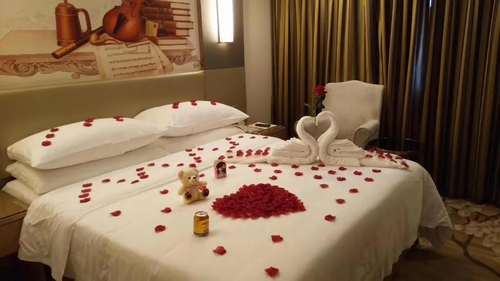 Bed in Vienna Hotel Shenzhen Guanlan Shanshuitianyuan Xintian