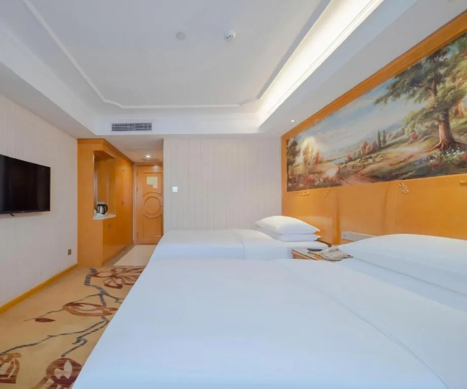 Bed in Vienna Hotel Shenzhen Guanlan Shanshuitianyuan Xintian