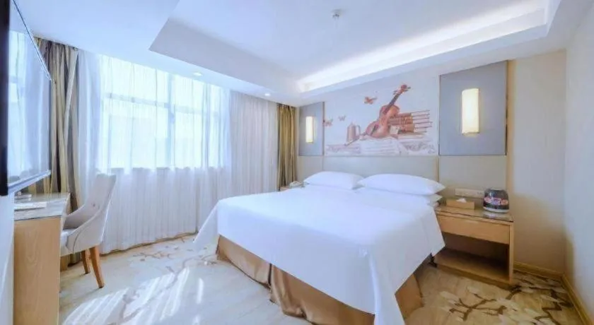 Bed in Vienna Hotel Shenzhen Guanlan Shanshuitianyuan Xintian