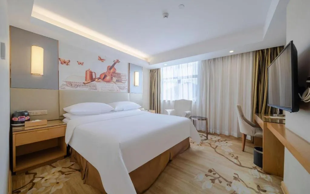 Bed in Vienna Hotel Shenzhen Guanlan Shanshuitianyuan Xintian