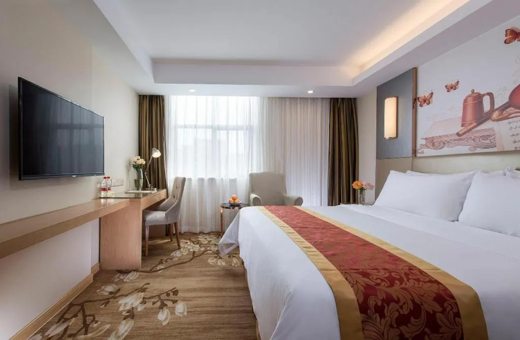 Bed in Vienna Hotel Shenzhen Guanlan Shanshuitianyuan Xintian