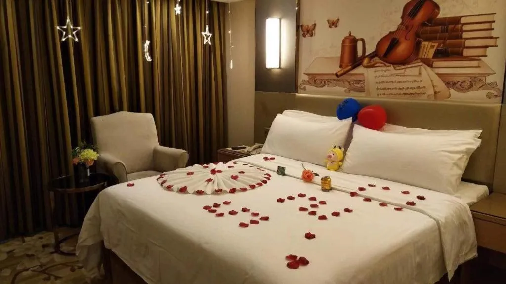 Bed in Vienna Hotel Shenzhen Guanlan Shanshuitianyuan Xintian