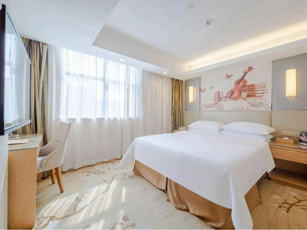 Bed in Vienna Hotel Shenzhen Guanlan Shanshuitianyuan Xintian