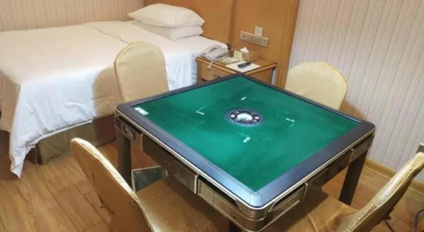 Bed in Vienna Hotel Shenzhen Guanlan Shanshuitianyuan Xintian