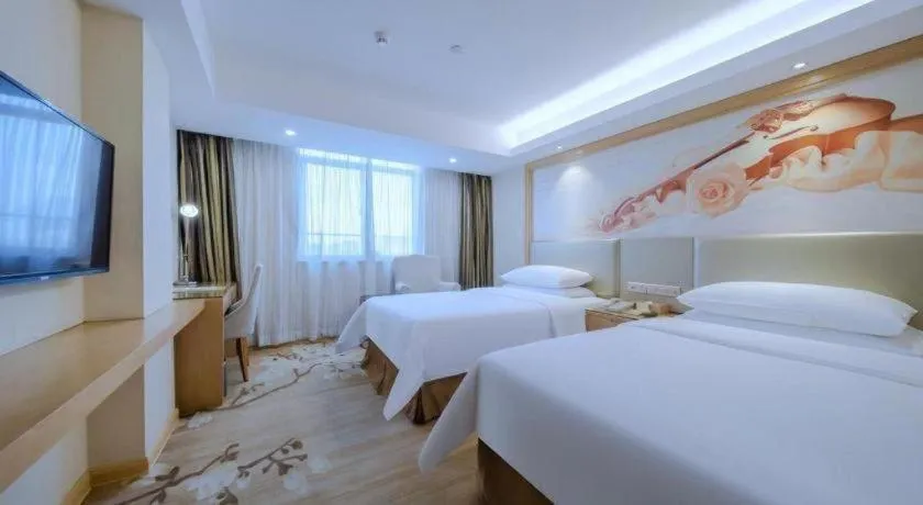 Bed in Vienna Hotel Shenzhen Guanlan Shanshuitianyuan Xintian