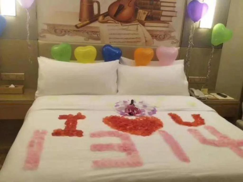 Bed in Vienna Hotel Shenzhen Guanlan Shanshuitianyuan Xintian